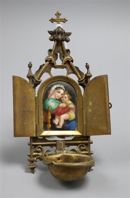 A Continental brass and ceramic religious plaque of a mother and child